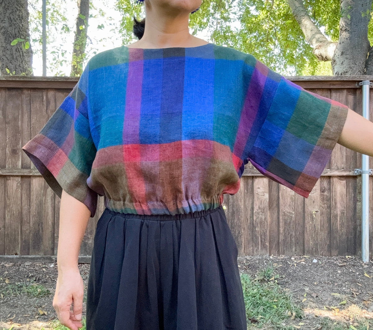 Crafted from 100% high-quality linen, the Blue Check Top offers breathable comfort for warm weather wear. Features a comfortable waist band and relaxed wide sleeves that move with ease.