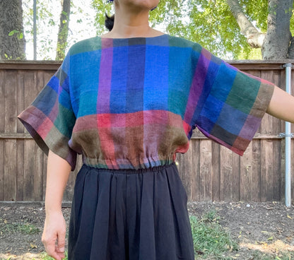 Crafted from 100% high-quality linen, the Blue Check Top offers breathable comfort for warm weather wear. Features a comfortable waist band and relaxed wide sleeves that move with ease.