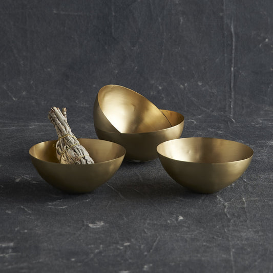 These petite brass bowls are a host's best friend. Optimally sized for serving condiments, nuts or candies, these thin-walled vessels are certainly not limited to a life near the kitchen. Consider one as a modern catchall atop a dresser, or as a shimmering soap dish in the bath.