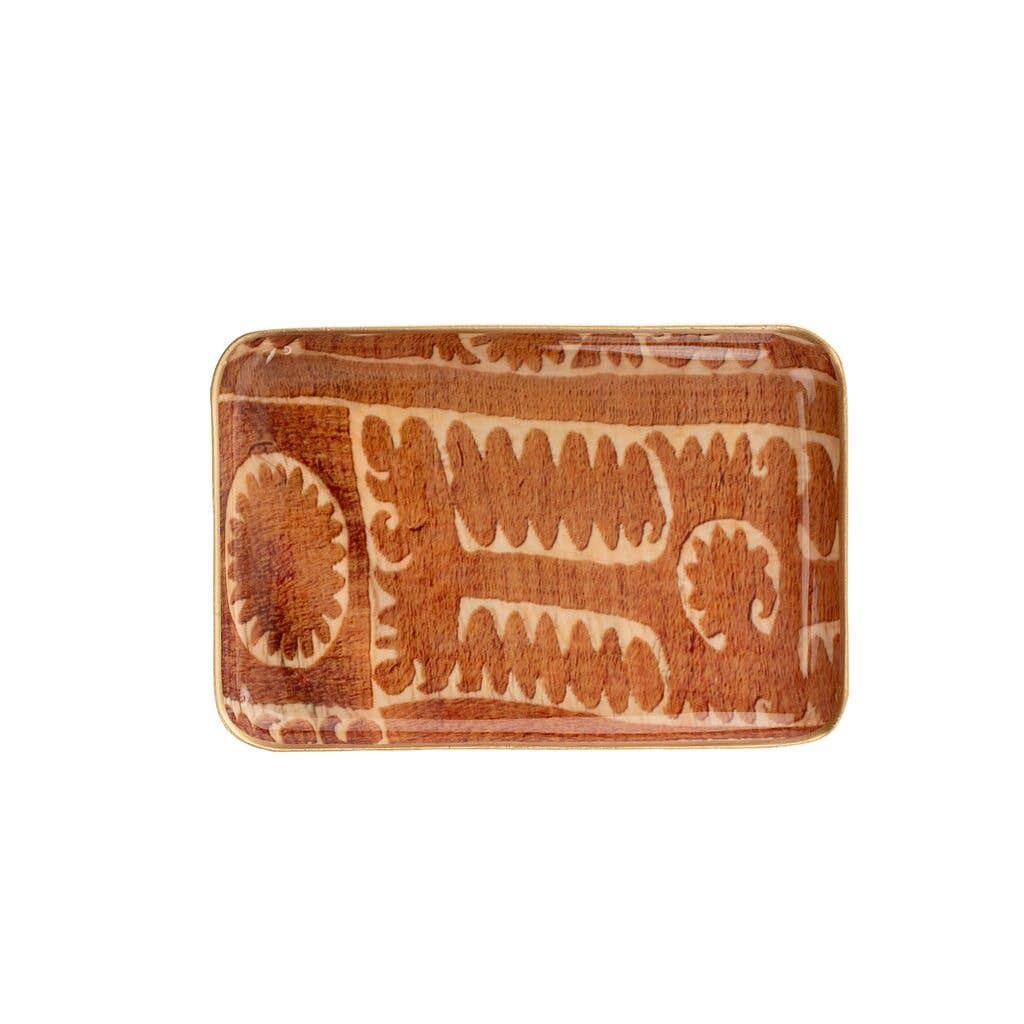 Featuring a bold rusty orange backdrop adorned with vintage-inspired Suzani patterns, these serving trays are ideal for adding both style and utility to your space.