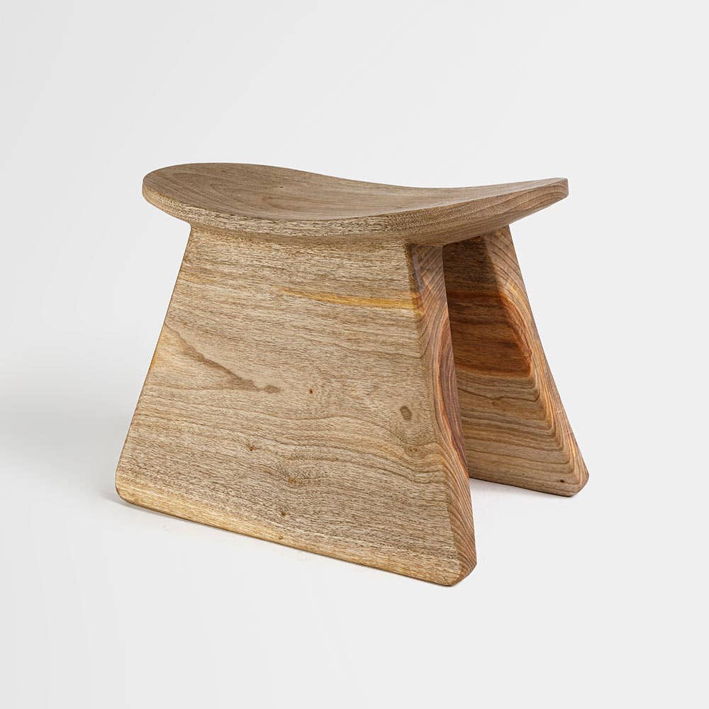 Hand-carved wood stool made from single piece of wood