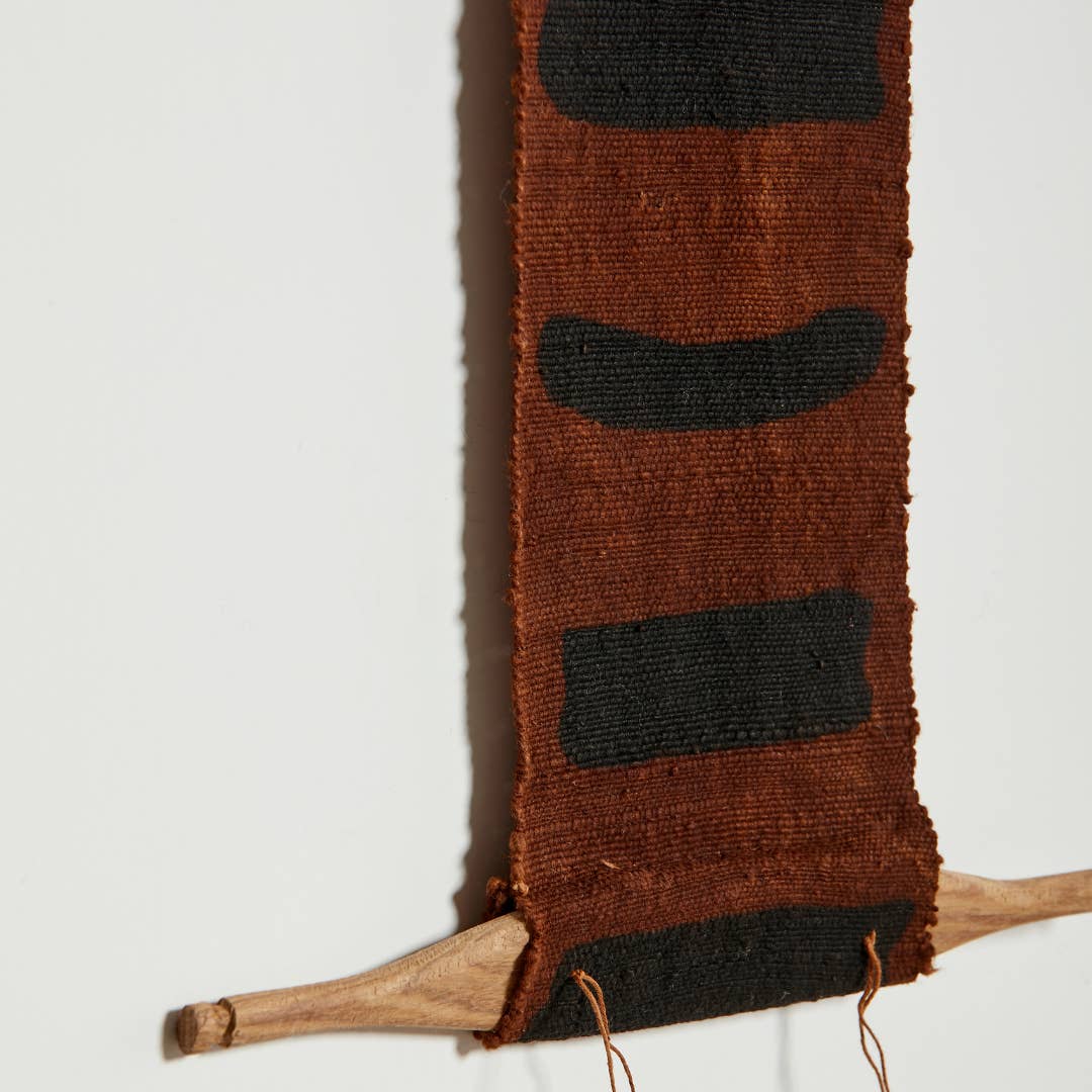 Handmade from ethically sourced natural materials, these wall totems are created using a traditional, generationally-taught handcraft process that goes back centuries. Features simple designs with ancient meanings, dyed with silt-based dyes.