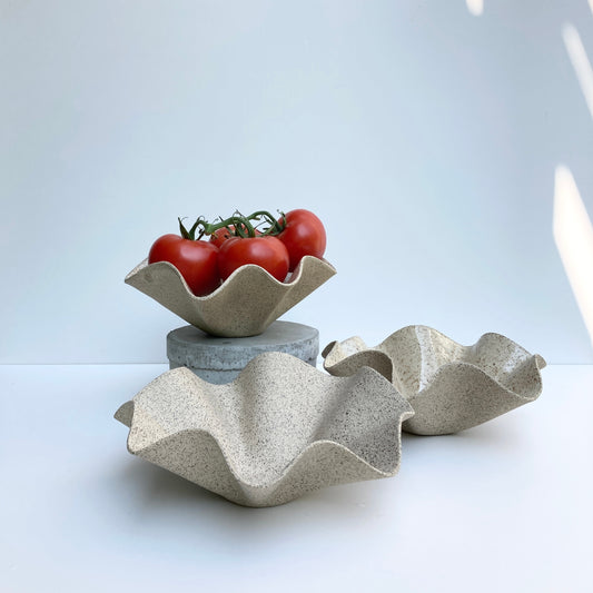 Wavy Handkerchief Bowl, a piece that combines functionality with artistic flair. Handcrafted with care and attention to detail, this bowl is perfect for adding a touch of unique style to your home decor. Made from sandy speckled ceramic clay, this bowl features a wavy design that mimics the folds of a handkerchief.

Freely hand painted.Handmade by Alicja in her Vermont studio.