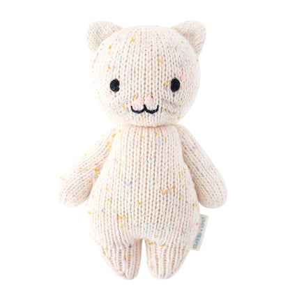 Knitted cat toy with a white background. Absolutely adorable and oh so collectible! At an endearing 7” tall, our lovingly hand-knit baby animals are made with natural 100% cotton yarn and perfectly sized for little hands to grab and hold.

Every baby animal purchased provides 5 meals to children in need and empowers artisans in Peru and Nepal with fair trade income.