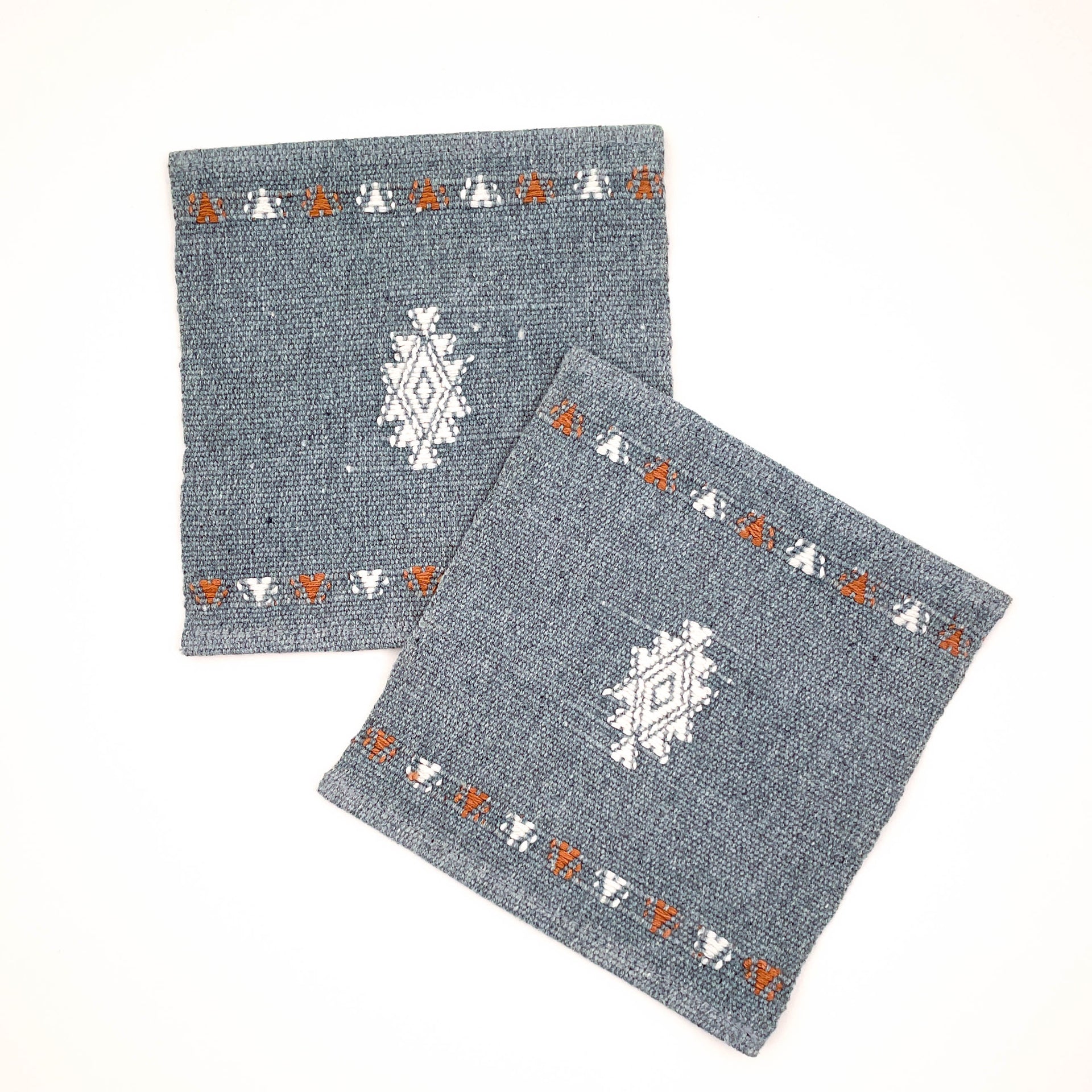 Set of two Mayan Hands coasters handwoven on a traditional backstrap loom by skilled Maya women artisans in San Rafael in Guatemala.