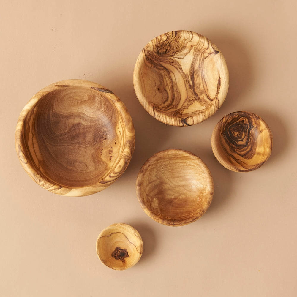 Handcrafted in Tunisia using natural olive wood from the region, these little bowls are hard, durable and non porous. Each piece is unique and becomes even darker, richer and more beautiful in color as it ages.