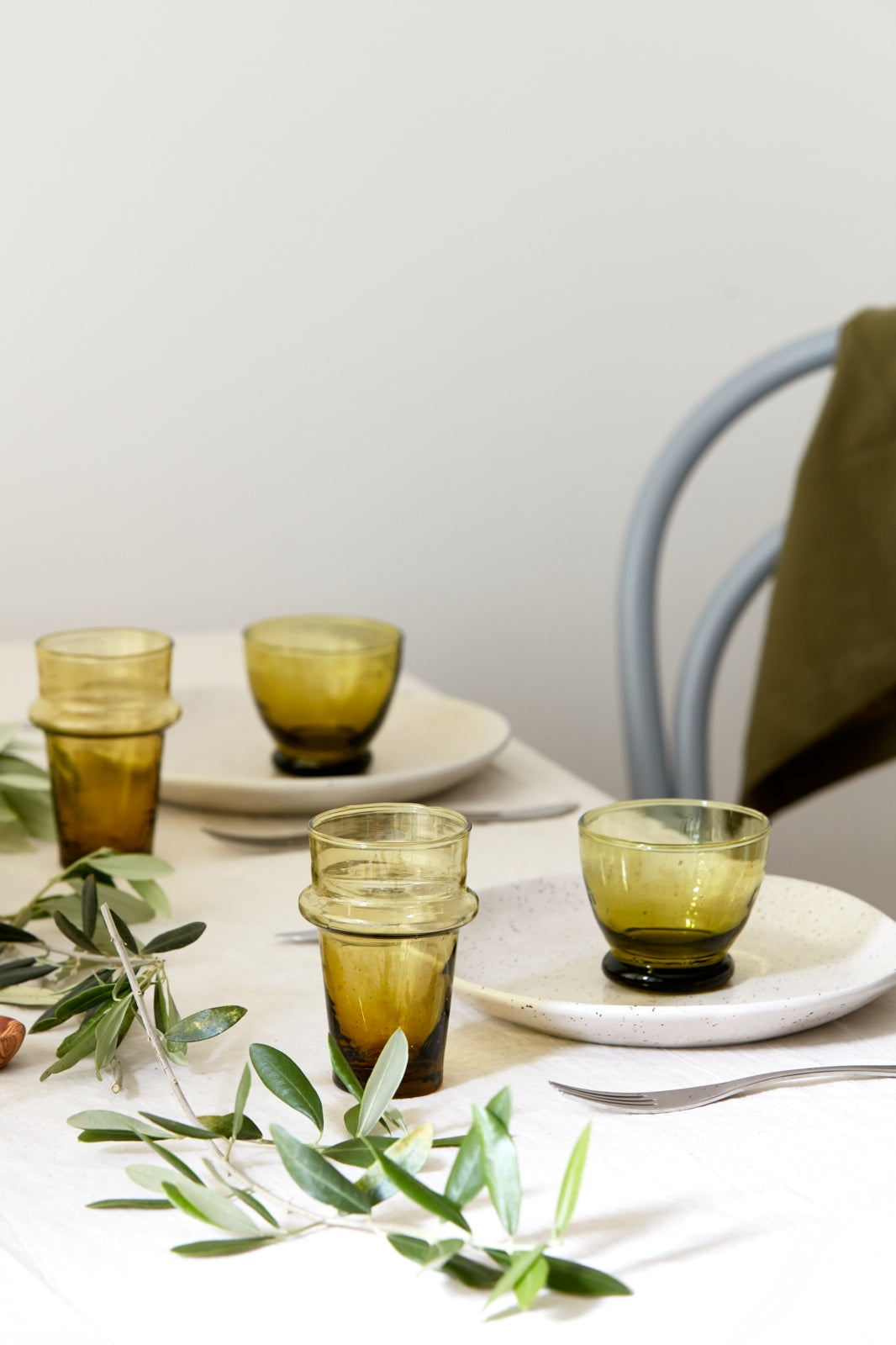 Simple and elegant, the modern glass cup is perfect to serve your favorite drinks or a little desert or even condiments. Handblown in morocco using local recycled beer bottles, giving these materials another life. These glasses are ideal for entertainment or everyday drink ware.