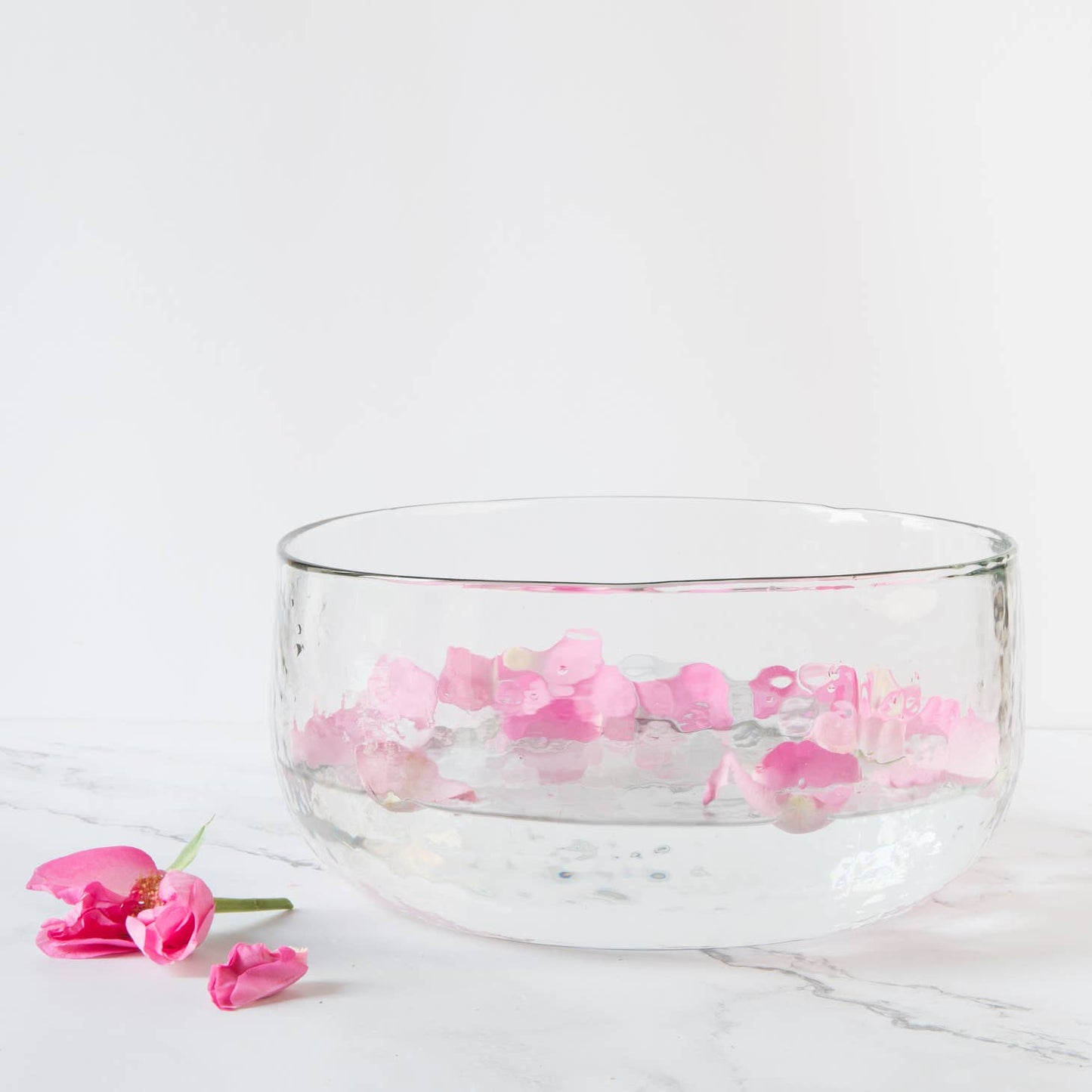 Made of thick, clear glass, this textured bowl looks lovely whether it contains fruit, salad, floating blossoms, a colorful side dish, or nothing at all. With so many possible uses, this one won't stay in the cupboard for long. Ethically made in India.
