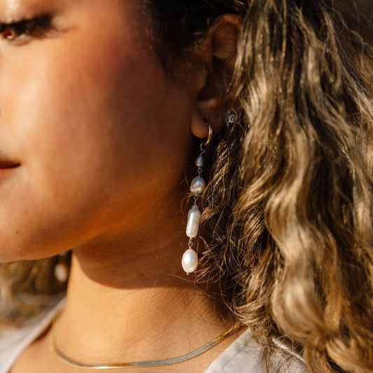 Unique and elegant, these pearl duster earrings were designed with 4 freshwater pearls in various shapes and sizes interconnected with delicate gold fill wire. All Dea Dia pieces are proudly designed and handmade in Downtown Los Angeles.