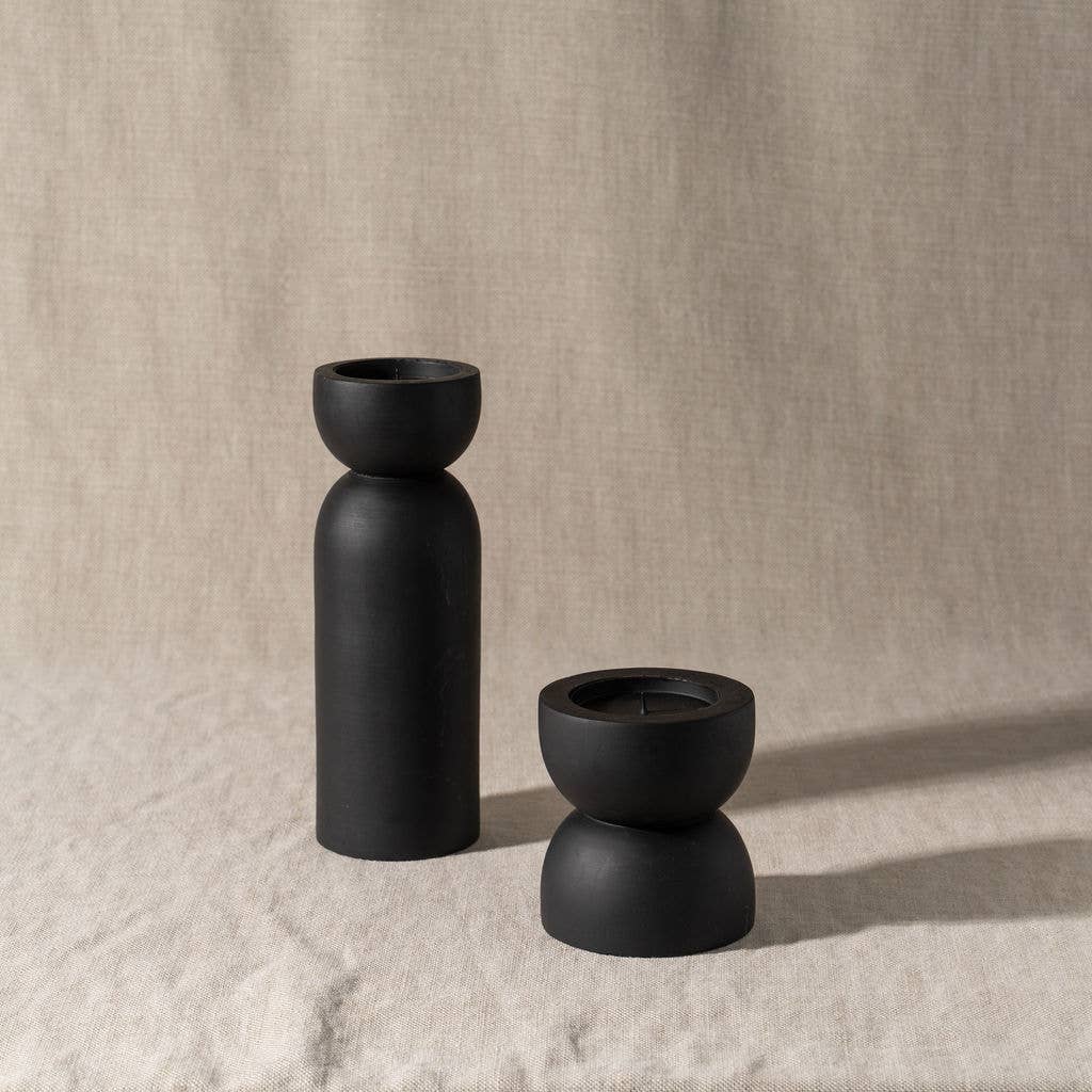 saarde home / Toulin candle holders are made from recycled mango wood and are stained with a japan black stain for a matte, slightly transparent finish.  Designed with metal candle plate with rim and spike so that both pillar and tapered candles can be accommodated.