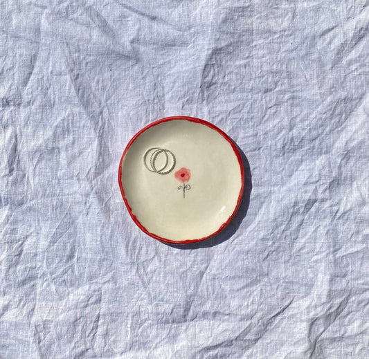 Handmade ceramic catchall plate perfect for organizing your favorite jewelry.

Thoughtfully sculpted, painted, and glazed by hand with food safe ceramic materials. Handmade in the US.