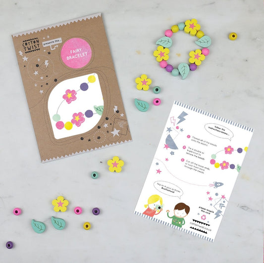 Children can construct their own bracelets using wooden beads together with the elastic provided. The elastic comes with metal ends to help children add beads with ease. Choose from fairy, unicorn, strawberry or daisy chain. Each kit is plastic free & lovingly assembled by hand.