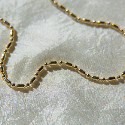 Unique, deadstock vintage ball chain necklace made current with a fresh plating of 14k gold. A perfect 90s vibe chain; use it to layer or add your favorite pendant. This 90's ball chain necklace comes with a long and short pattern.  Designed and handmade in Los Angeles.