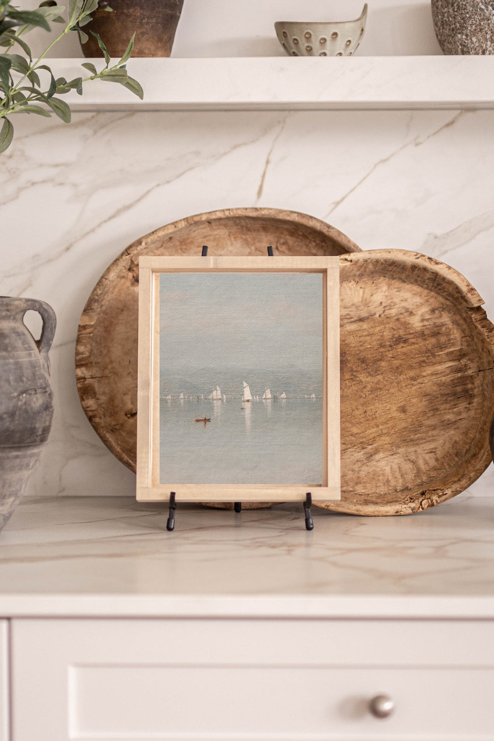 Vintage wood-framed print of sailboats on the water
