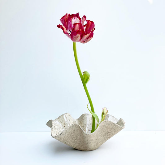 Wavy Handkerchief Bowl, a piece that combines functionality with artistic flair. Handcrafted with care and attention to detail, this bowl is perfect for adding a touch of unique style to your home decor. Made from sandy speckled ceramic clay, this bowl features a wavy design that mimics the folds of a handkerchief.

Freely hand painted.Handmade by Alicja in her Vermont studio.