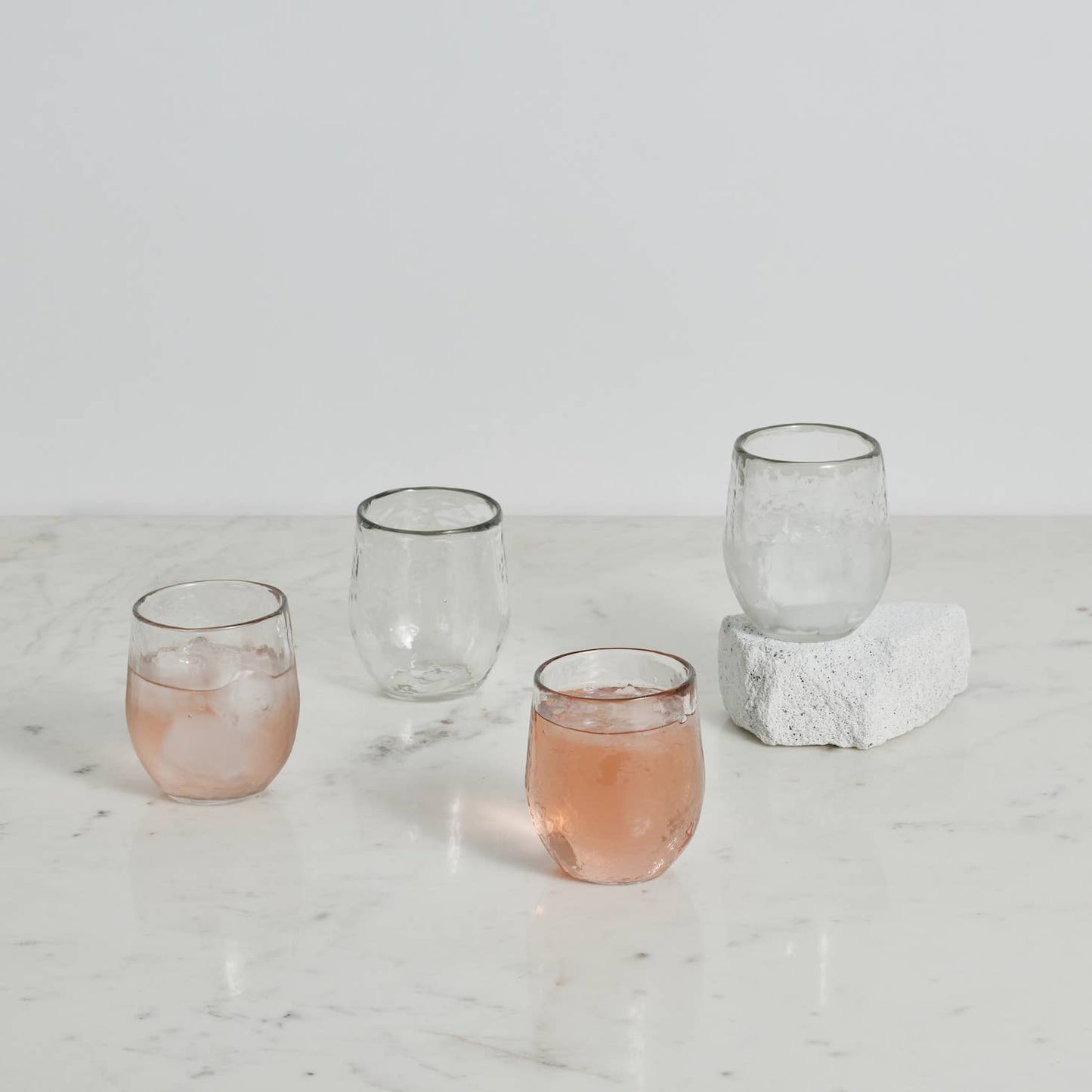 Whether used for a special aperitif or for your daily juice, the versatile 7 oz. Spirits glass will soon become family favorites. This subtly hammered clear glassware is finished with a hand polish that highlights its texture. Ethically made in India.