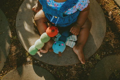 This hand crocheted rattle is designed to delight little hands and engage curious minds. The gentle rattle sound encourages sensory exploration while the soft, tactile textures make it perfect for grasping, shaking, and cuddling.