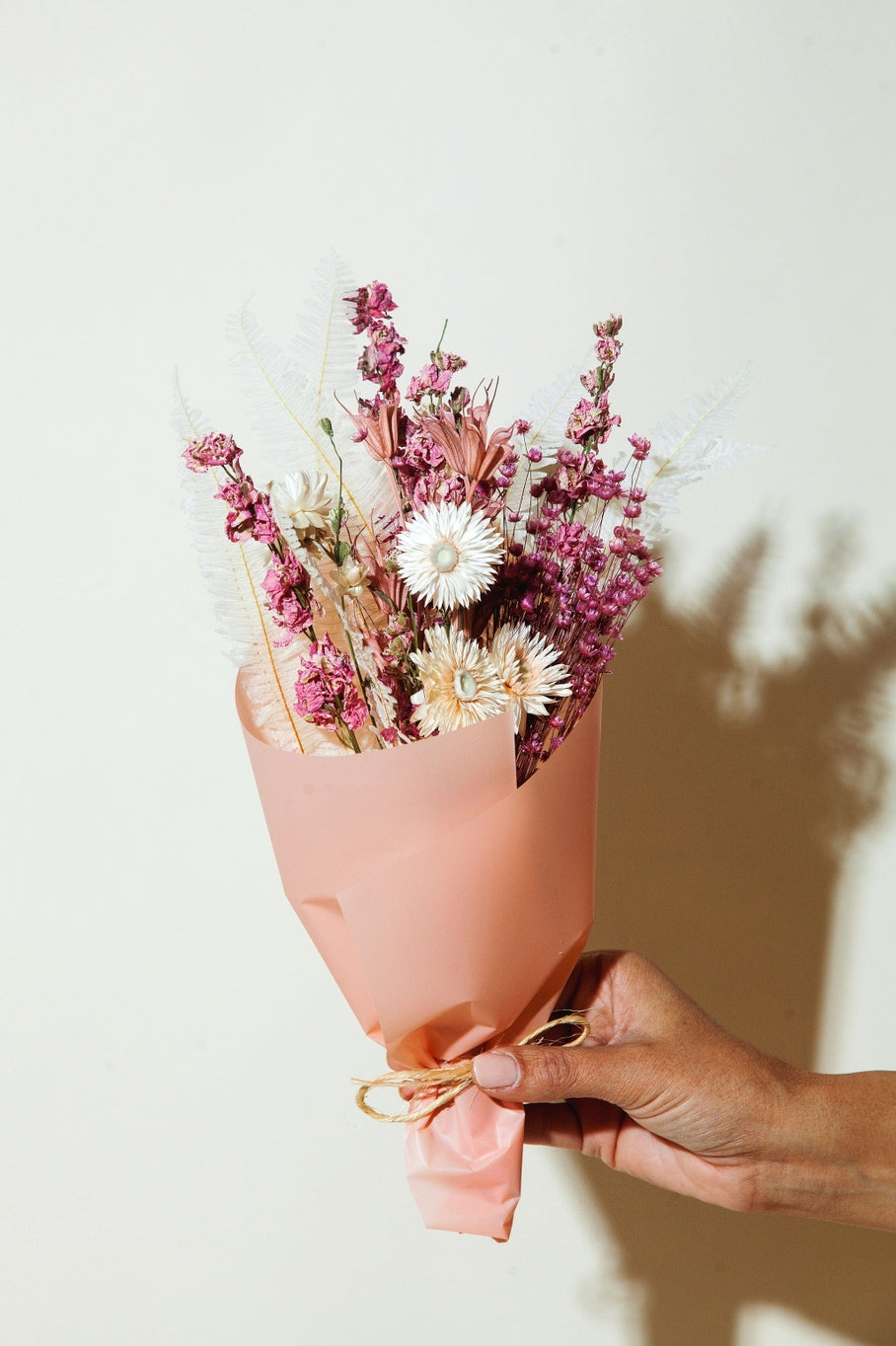 This dried bouquet is carefully arranged by a team of designers in Idlewild Floral Co's California studio, and are made of beautifully preserved long lasting flowers. Perfect paired with a bud vase or as a gift for any occasion. Each bouquet is 12"-14" long x 4"-6" wide.