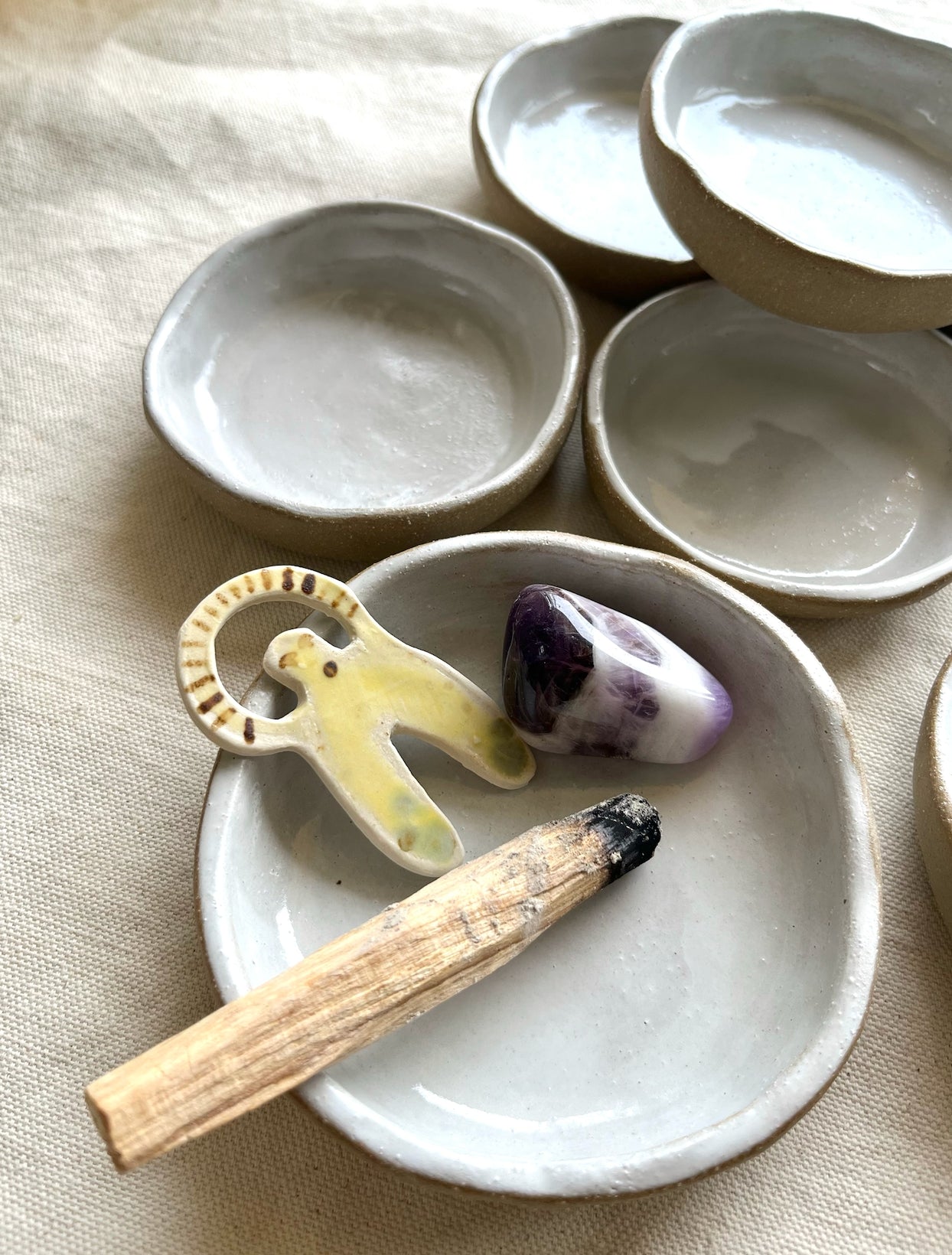 A simple and beautiful little ceramic catch-all. A lovely space to place jewelry, store incense, tapas dish, to rest your sage or palo santo -- the options are endless. Hand built, glazed and fired in Slo, Ca.