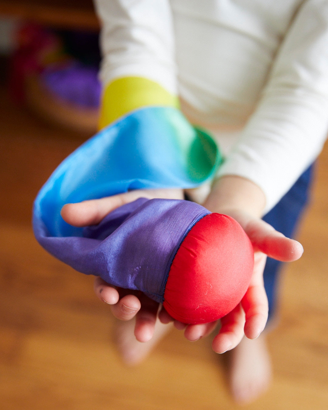 Throw it! Catch it! Spin it! A "bonkless" rubber ball covered in silk, easy to throw by the tail and does not hurt when you get hit by it. Bounces along the ground a few times for more catching chances. A stuffed ball with a silk tail, available in two styles.