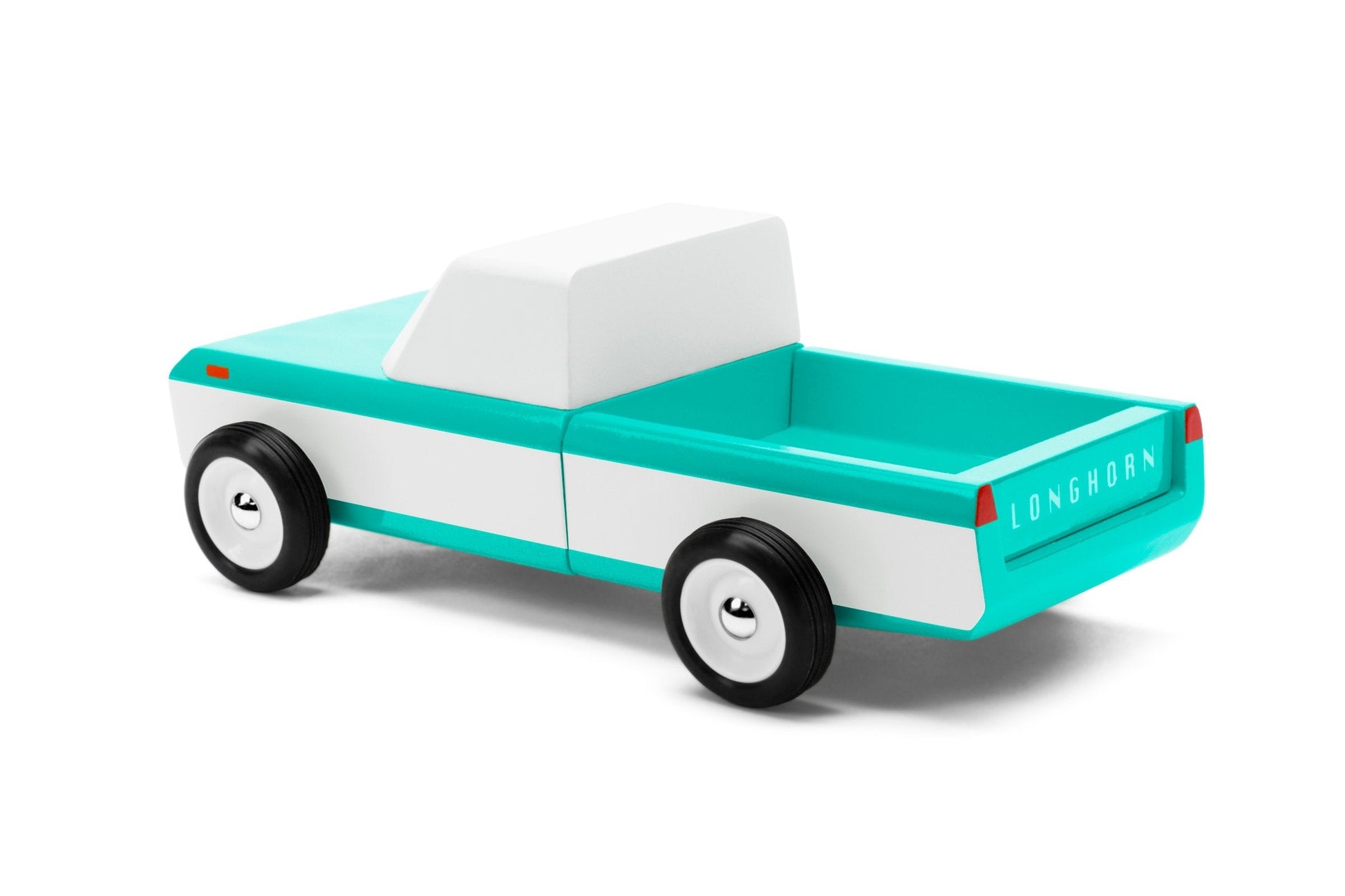 Longhorn toy truck by Candylab. Their first pick-up because c'mon, we all need a little pickup in our lives. Comes in two color variations - don't forget, you can pile your surfboards in the truck bed!