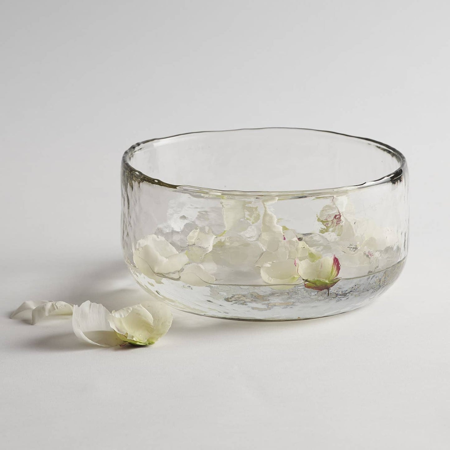 Made of thick, clear glass, this textured bowl looks lovely whether it contains fruit, salad, floating blossoms, a colorful side dish, or nothing at all. With so many possible uses, this one won't stay in the cupboard for long. Ethically made in India.