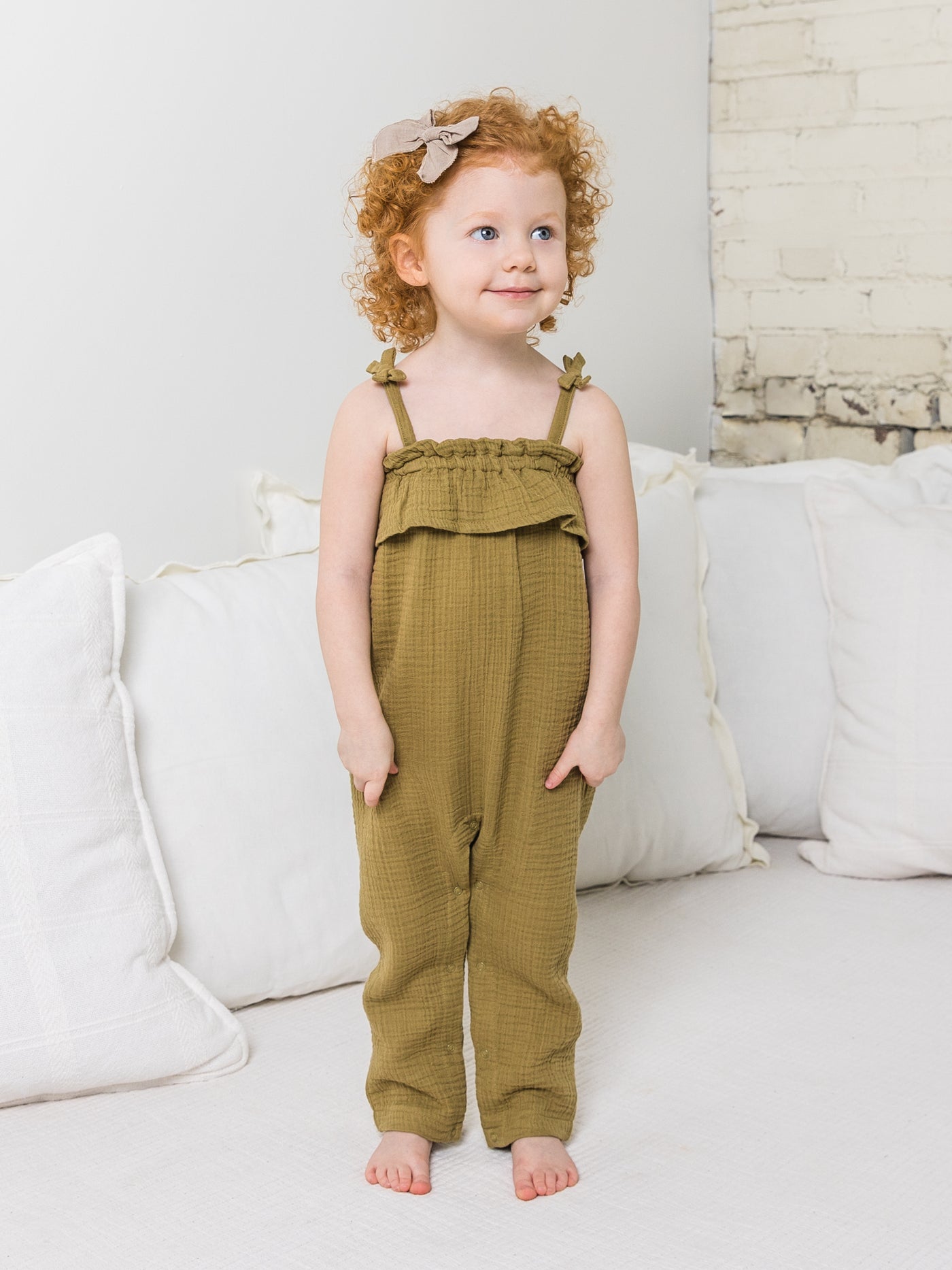 It's all in the delicate details! The Fiona Muslin Romper's has an elastic neckline on the ruffled top, with adorable faux bows on the romper's strap. Nickel-free snaps line the leg opening for simple dressing. 100% organic cotton muslin