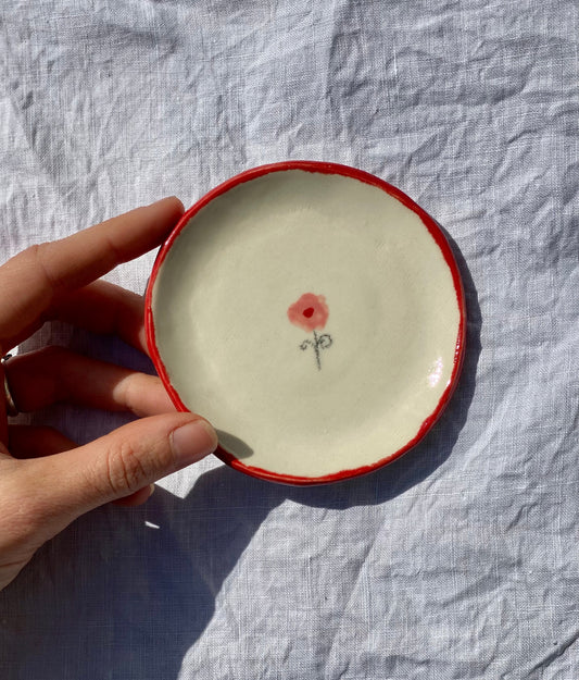 Handmade ceramic catchall plate perfect for organizing your favorite jewelry.

Thoughtfully sculpted, painted, and glazed by hand with food safe ceramic materials. Handmade in the US.