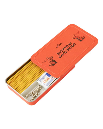 Orange tin box with 'Everyday Good Wood' branding, containing wooden matches and Japanese incense.