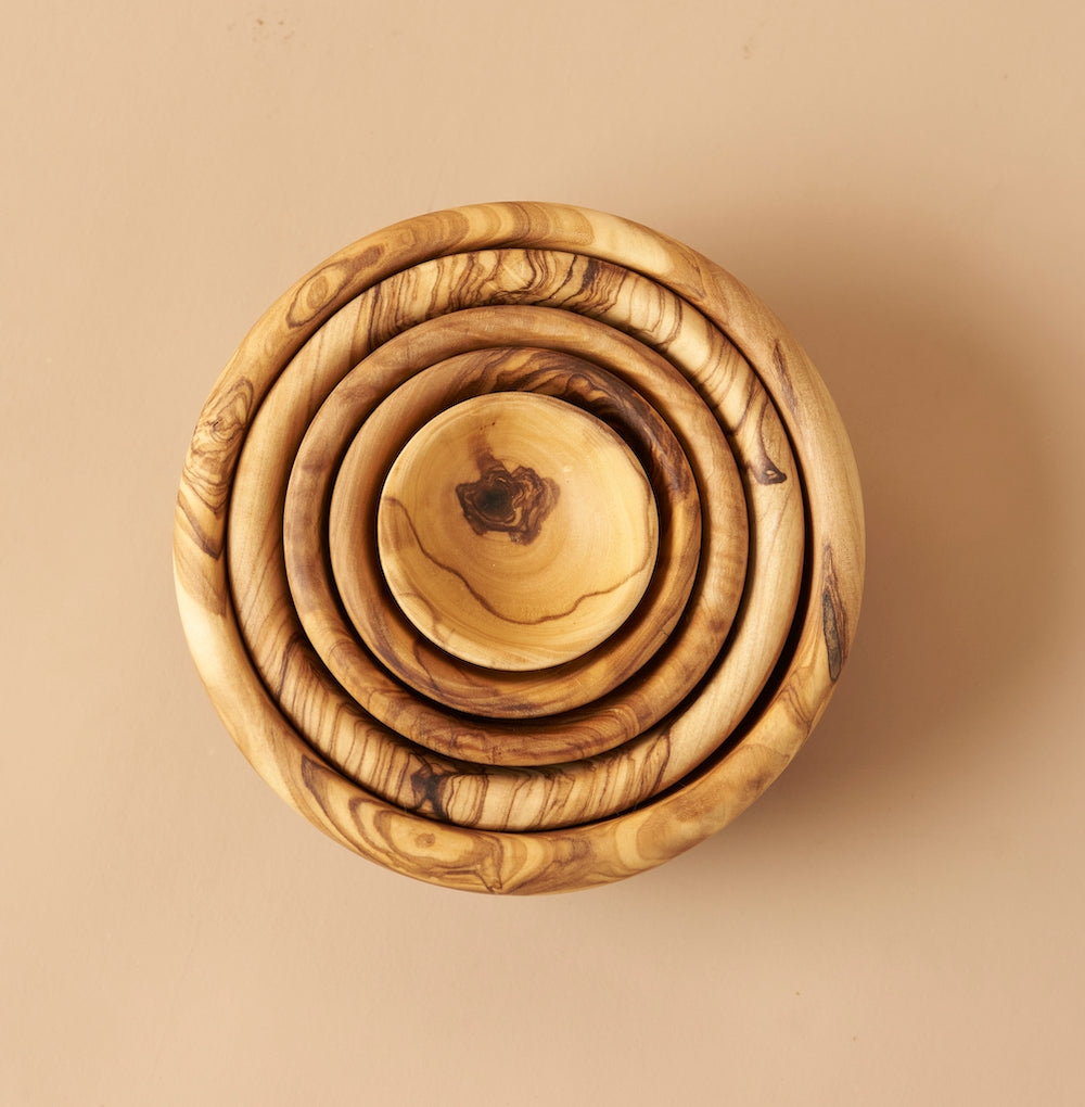 Handcrafted in Tunisia using natural olive wood from the region, these little bowls are hard, durable and non porous. Each piece is unique and becomes even darker, richer and more beautiful in color as it ages.