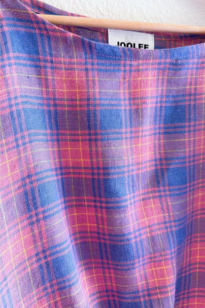 Crafted from 100% high-quality linen, the Lilac Check Top offers breathable comfort for warm weather wear. Features a comfortable waist band and relaxed wide sleeves that move with ease.