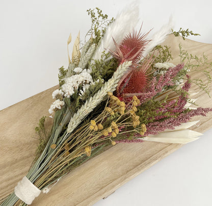 Andaluca’s floral team designed this beautiful bouquet using a mix of wildflowers, grains, bunny tails, and palm leaf to create this lush and opulent bouquet arrangement. 