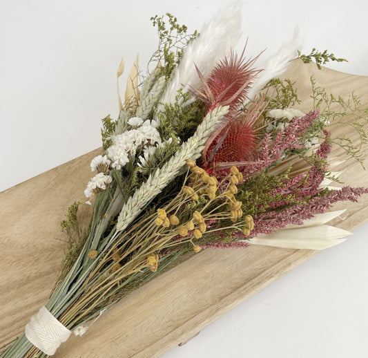 Andaluca’s floral team designed this beautiful bouquet using a mix of wildflowers, grains, bunny tails, and palm leaf to create this lush and opulent bouquet arrangement. 