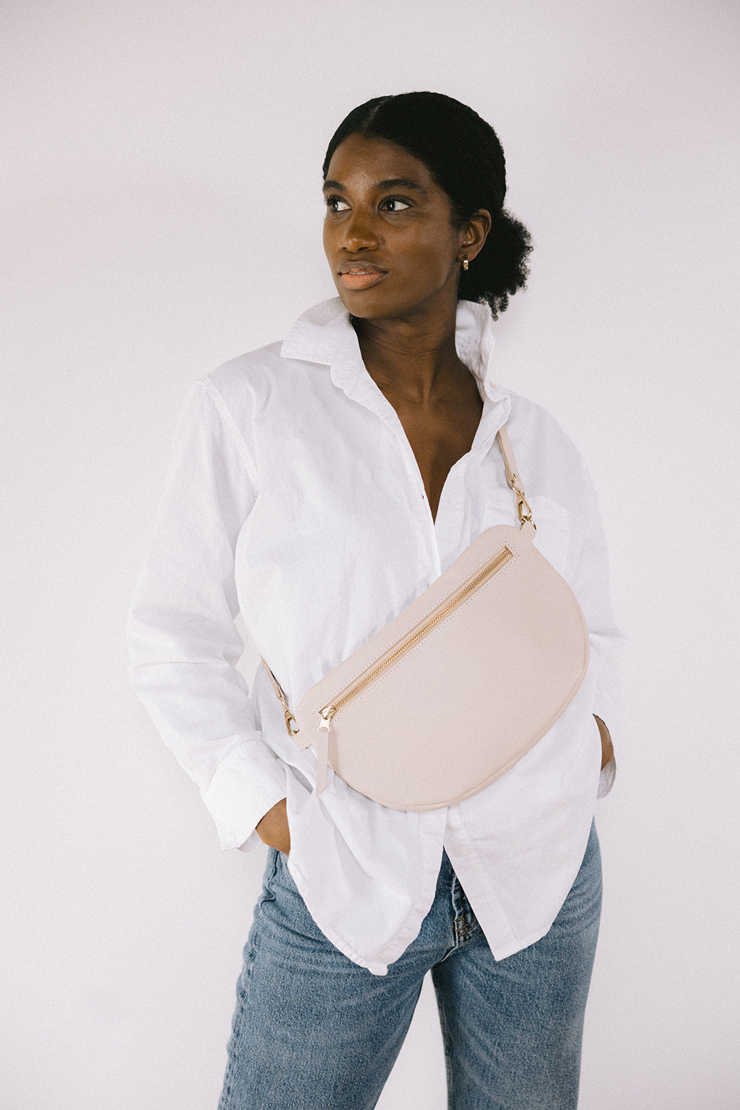 The best-selling Sling Bag is now available in a bigger size. Still sleek, lightweight, and chic, now you'll be able to add that *one* extra thing. Your large wallet, glasses case, or even a small book will fit inside the Big Sling. Fair trade and adjustable leather sling bag/fanny pack.