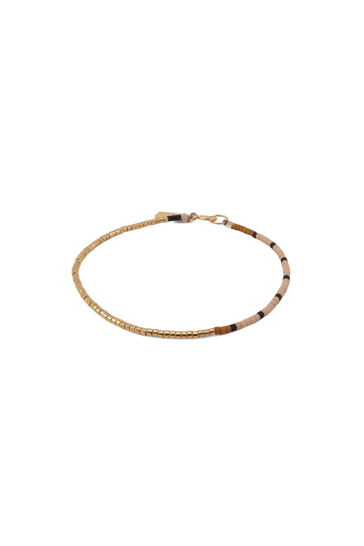 The Nootka Bracelet has an asymmetrical design featuring a long gold beaded segment and a sequence of black beads among a stretch of palette colors.