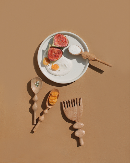 Discover the joy of cooking with these handcrafted wooden spoons! Artisans have infused each piece with love and creativity, featuring groovy handles for a fun and easy grip. Handmade in India.