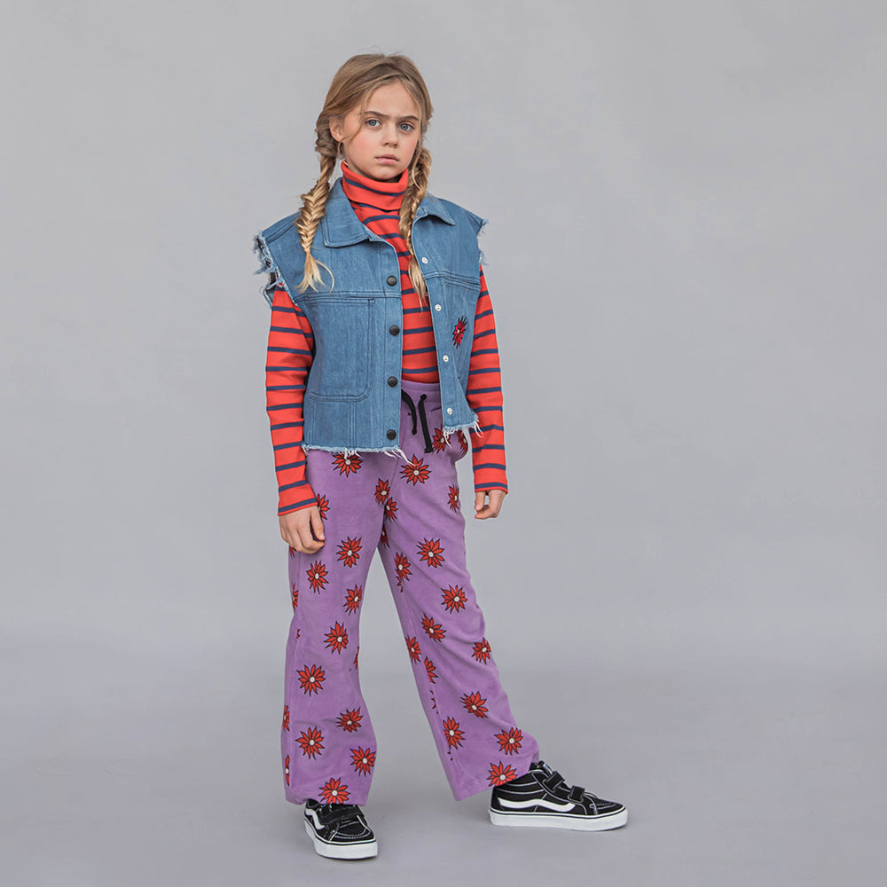 Purple based flared legging with a red flower print made with 95% organic cotton. Ethically produced, colorful and fun with an eye towards comfort, style and joy. Modern and sustainable kids clothing by CarlijnQ of the Netherlands.