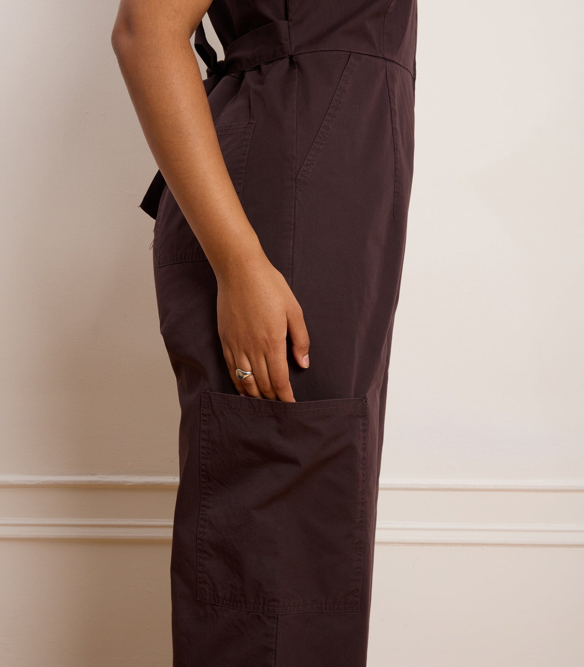 The one and done Bella Jumpsuit takes your through your whole day. Made from washed light weight but hardy twill and featuring a front zipper, front and back and cargo pockets and attached self belt that can we tied in the front or back.