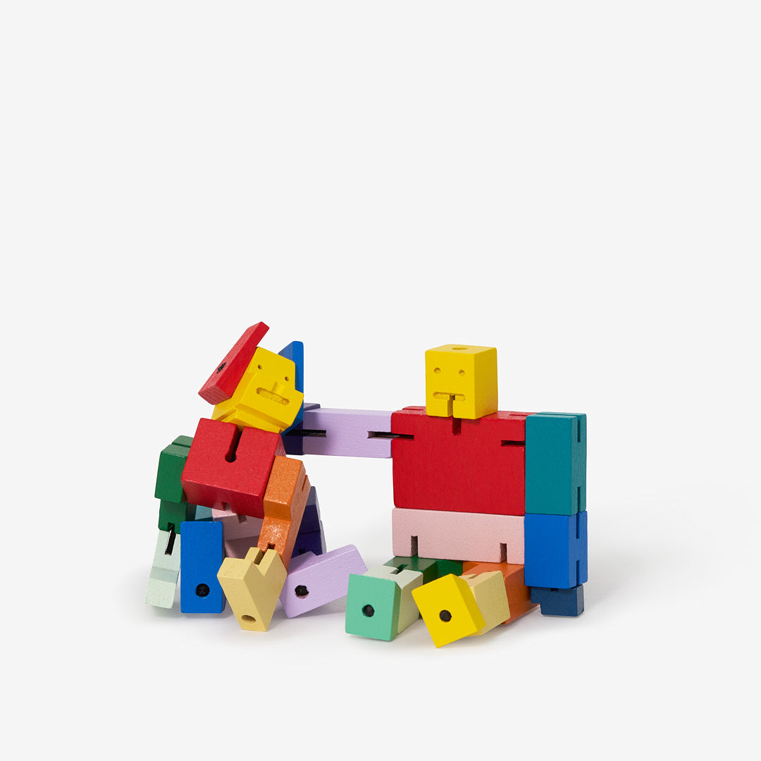 Colorful toy building block set on a white background. Areaware colorful cubebots.