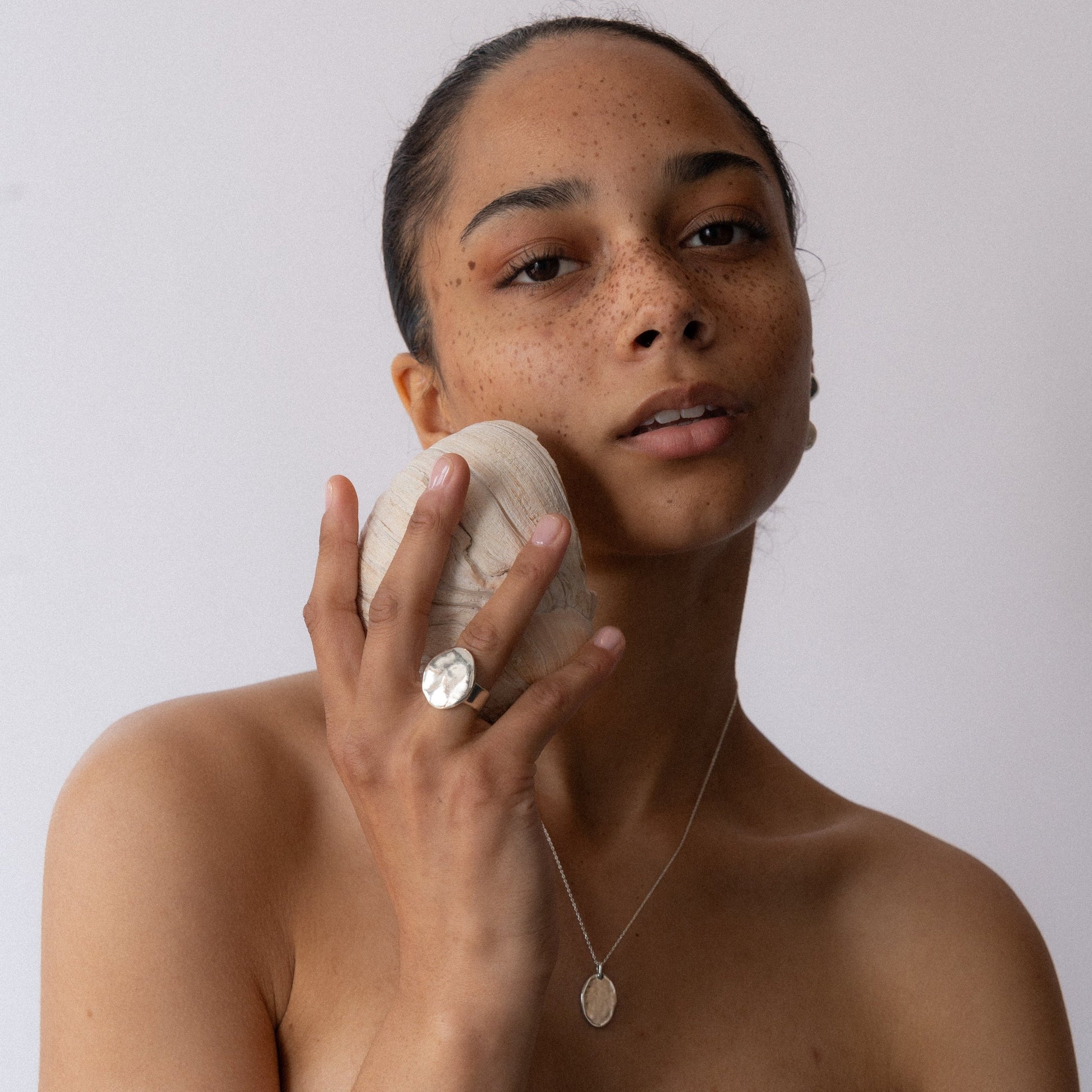 Crafted meticulously in shimmering bronze or sterling silver, with a watery finish, this ring makes a bold statement, both in weight and appearance, inviting wearers to embrace their inner strength and intuition. Handmade in Santa Cruz by Amanda Hunt.