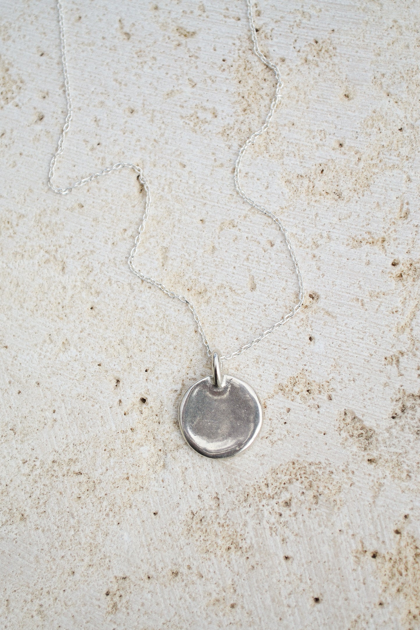 A classic everyday medallion necklace. Simple and feminine with a fluid feel. Inspired by the artist Georgia O'Keeffe. Georgia Necklace by Amanda Hunt