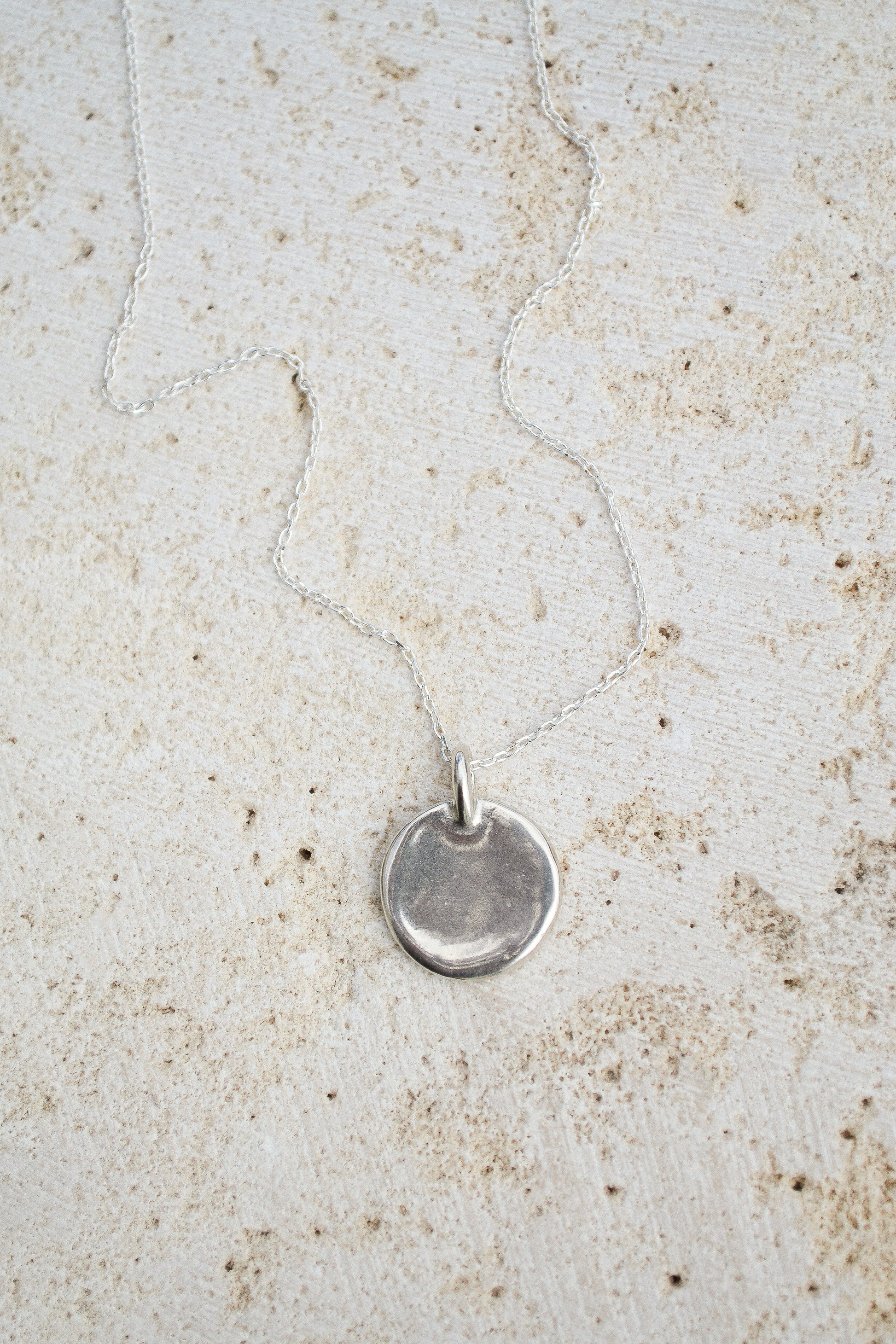 A classic everyday medallion necklace. Simple and feminine with a fluid feel. Inspired by the artist Georgia O'Keeffe. Georgia Necklace by Amanda Hunt