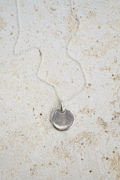 A classic everyday medallion necklace. Simple and feminine with a fluid feel. Inspired by the artist Georgia O'Keeffe. Georgia Necklace by Amanda Hunt
