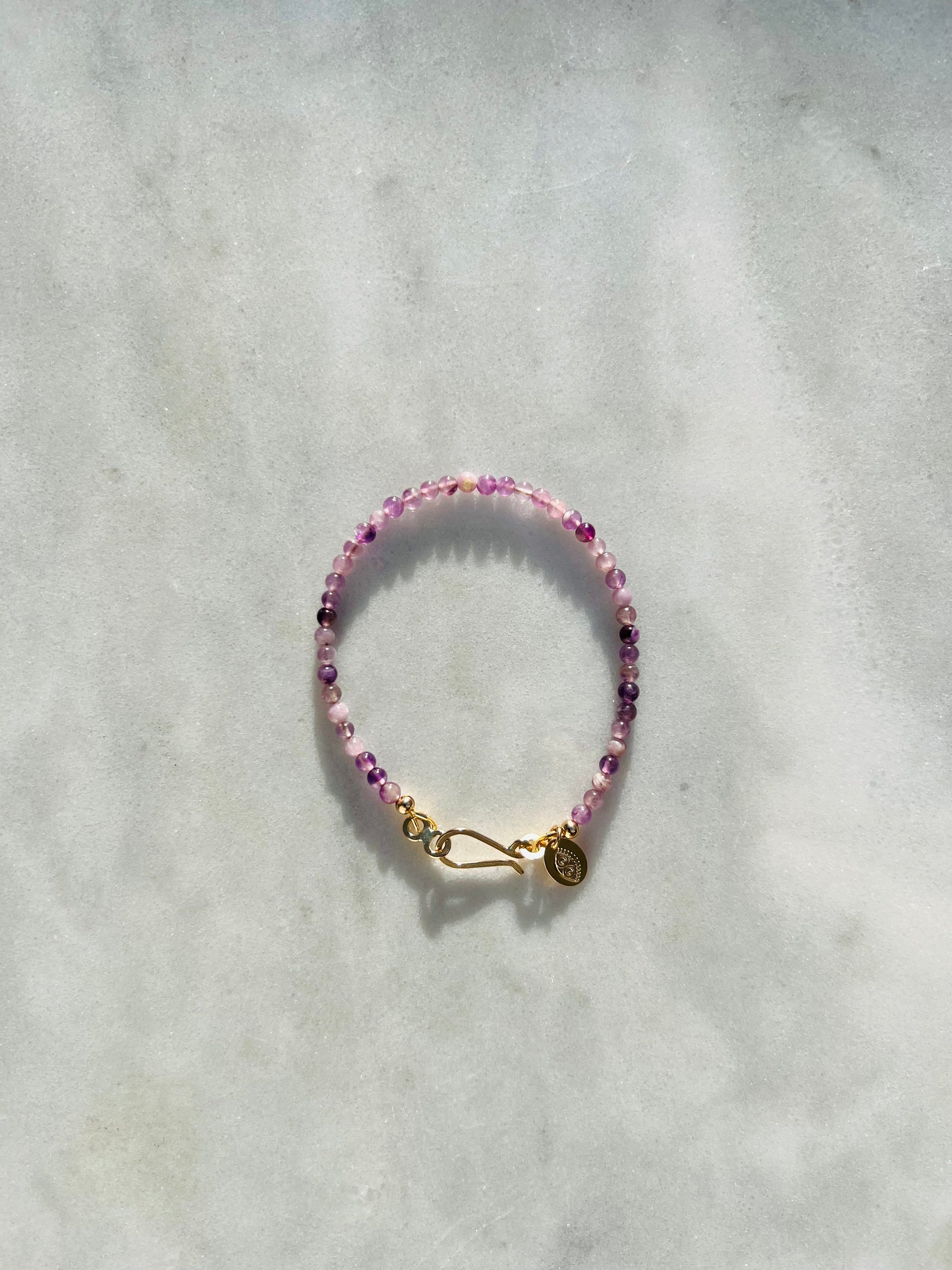 Originally named after its pointy growth pattern, purple calcite beads are smoothed out to rid your aura of stagnancy.  From Punkwasp's Power Collection - one of a kind pieces designed to energetically align you with your highest self.