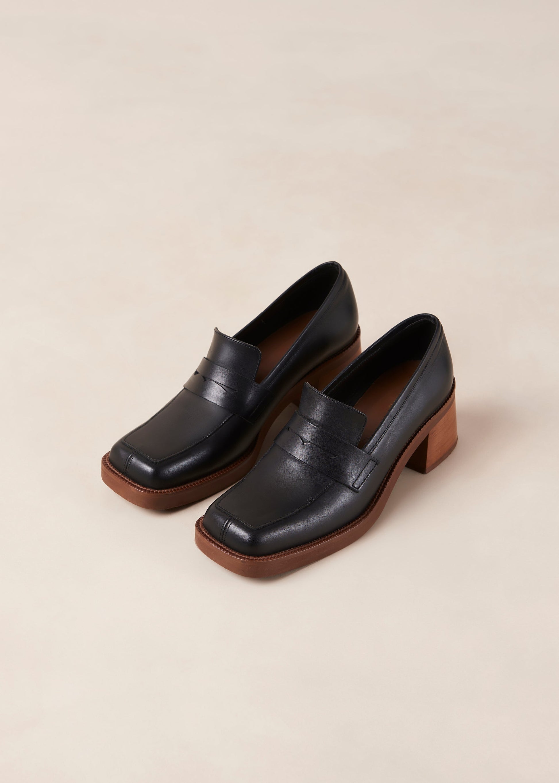 If you are always game for extra height, Roxanne is the loafer-pump hybrid you have been craving for. Think your evergreen moccasin silhouette set atop a chunky block heel for a little flattering elevation. They come in premium black leather and feature the classic penny tab across the vamp. Sustainably made in Spain. Alohas Roxanne Black Leather Loafer.