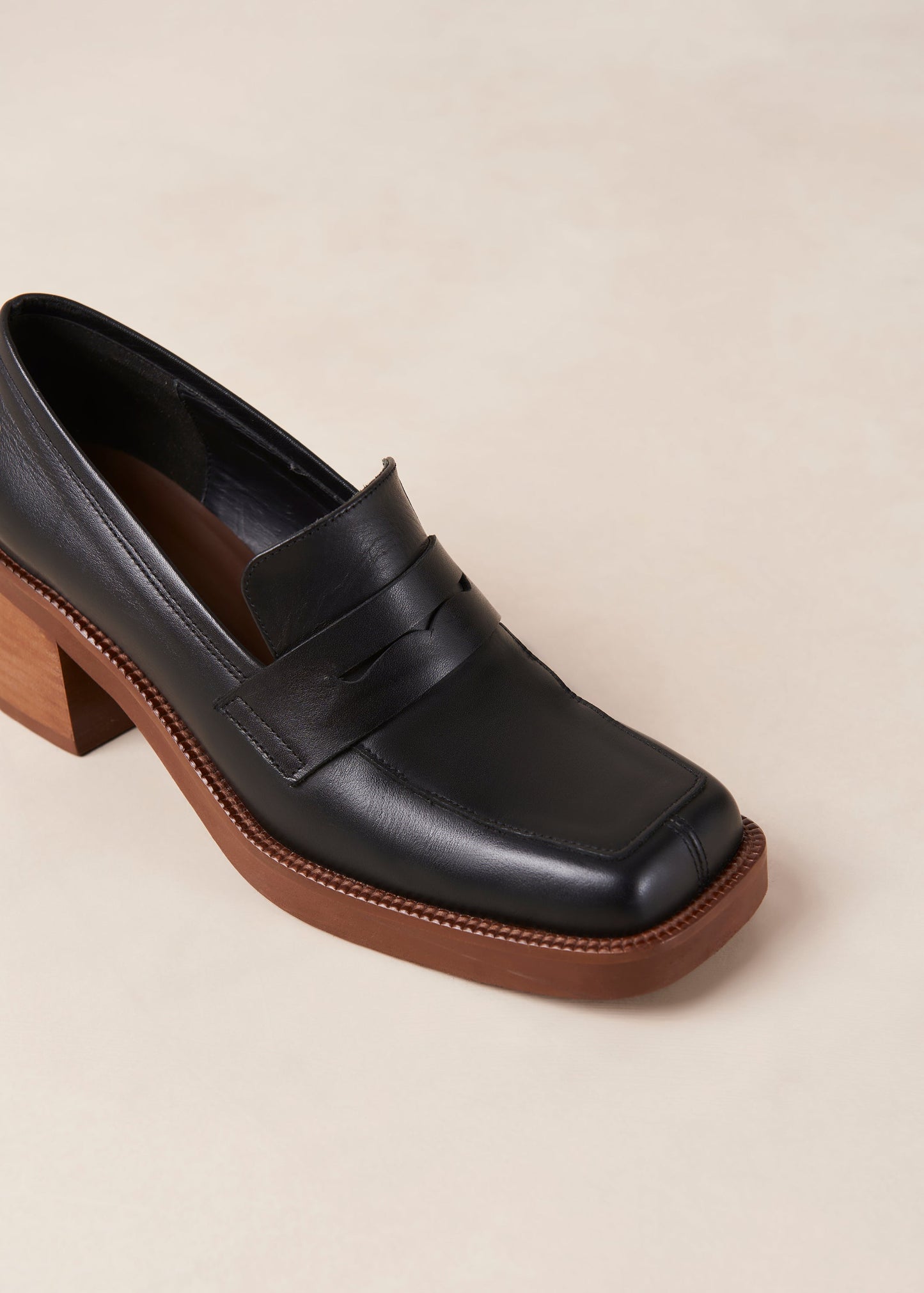 If you are always game for extra height, Roxanne is the loafer-pump hybrid you have been craving for. Think your evergreen moccasin silhouette set atop a chunky block heel for a little flattering elevation. They come in premium black leather and feature the classic penny tab across the vamp. Sustainably made in Spain. Alohas Roxanne Black Leather Loafer.