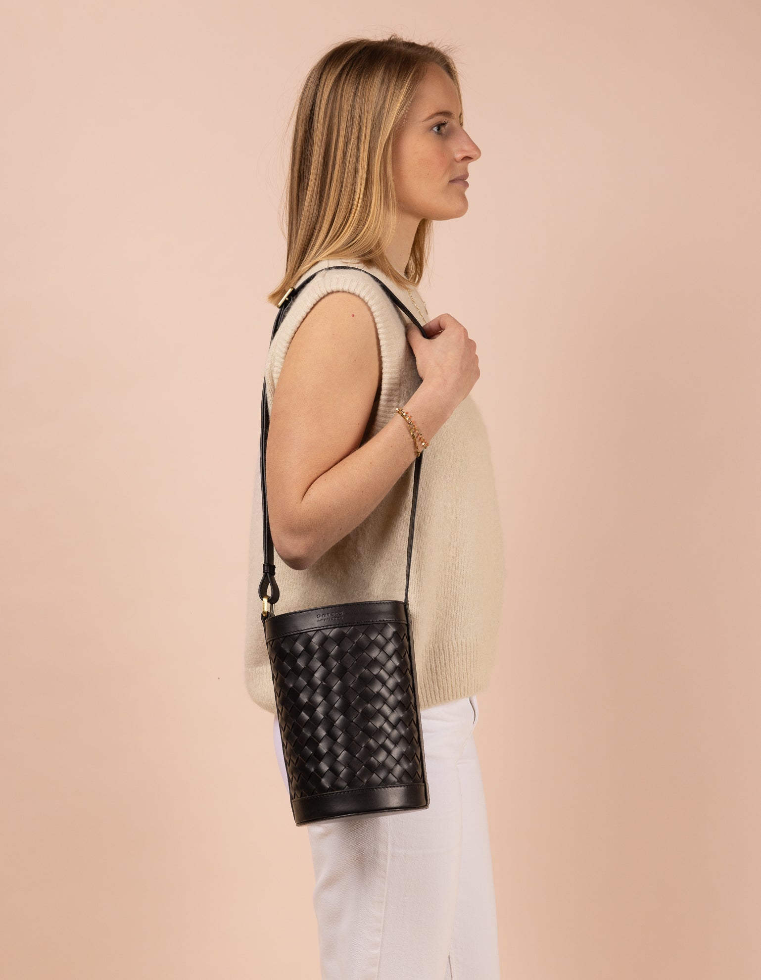 o my bag / With a round design, drawstring closure, and an adjustable leather strap, Zola adapts effortlessly to your style. Inside, find a zipper pocket and slip pocket for organization. Zola transitions seamlessly from shoulder to cross-body. Ethically made in India.