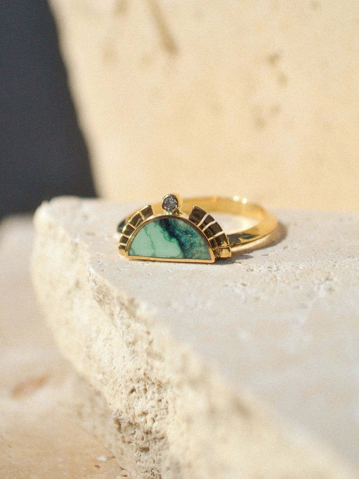 young in the mountains /  A half circle of warm 14k yellow gold is wrapped around an inlaid Angel Wing Variscite stone while a serrated halo of light complete with a centered .03 white diamond radiates from this sun