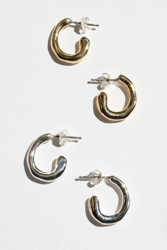 moneh brisel jewelry / The Fluid hoops embody the abstract and playful shape of water. The soft round edges and organic details serve as a reminder to flow with the day ahead of you. Perfect mini everyday hoops.