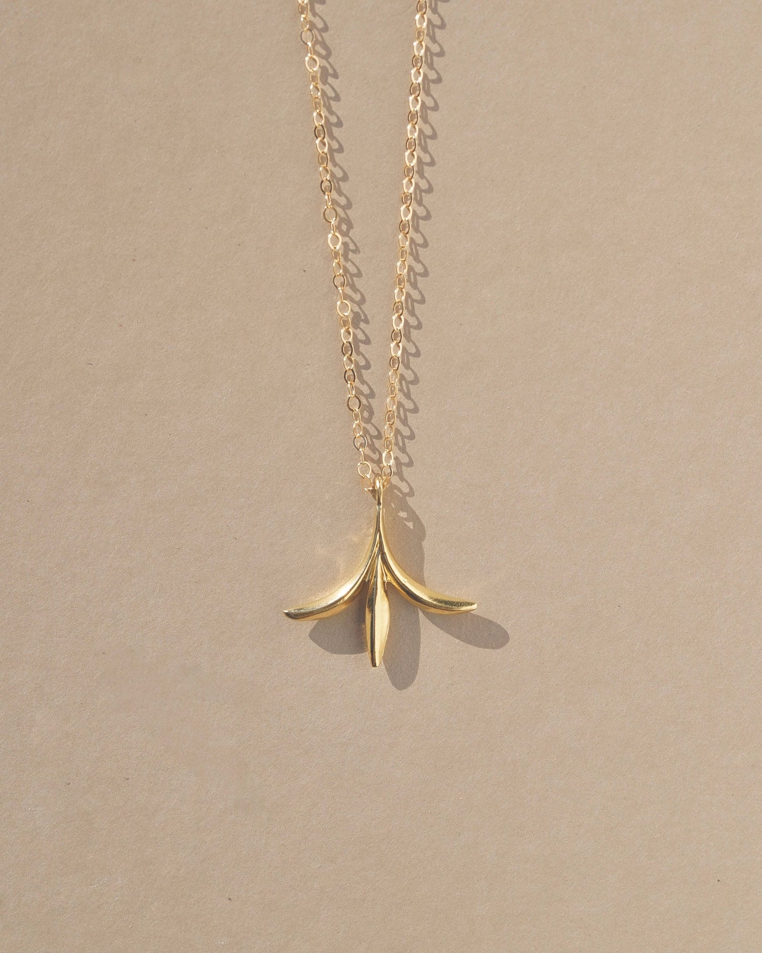 Delicate botanical enchanted pendant inspired by forest folklore and the seeds of the Calocedrus decurrens - California Incense Cedar tree. Handmade in the Santa Cruz Mountains.